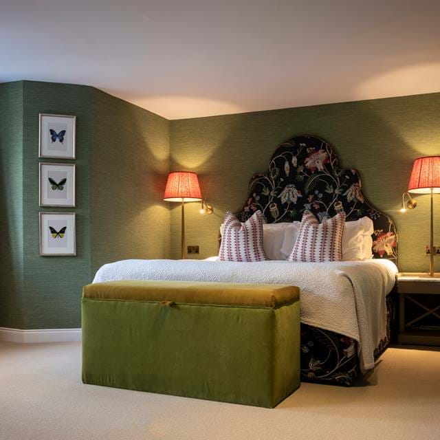 Luxurious 1887 suite at The Torridon with plush seating and elegant rustic decor.