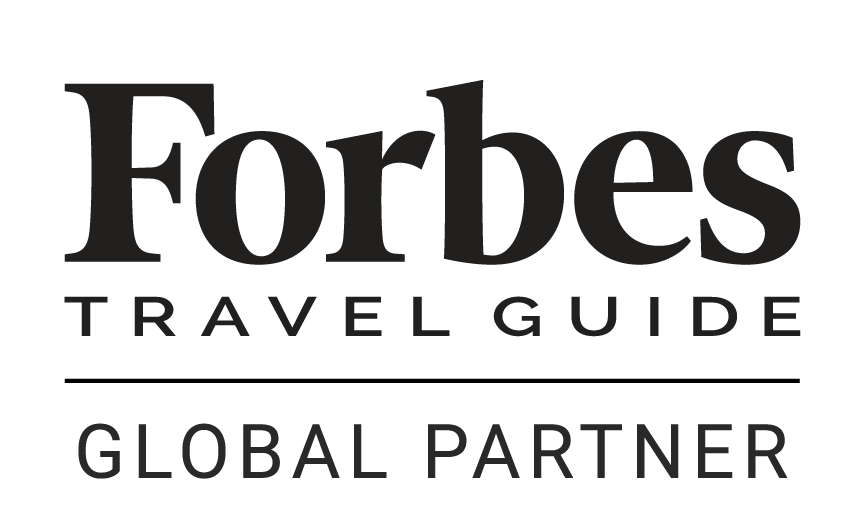 Forbes Global Partner logo, awarded to The Torridon Hotel for excellence in luxury hospitality.